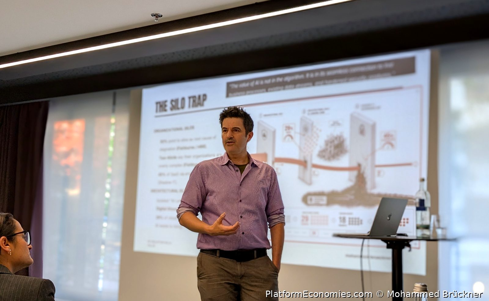 Mohammed Brückner on stage presenting the Silo Trap at the Munich AI in Product workshop